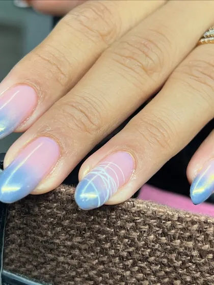 A closer look at the blue ombré with chrome and a delicate spider gel accent.