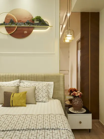 A closer look at the bedside details. The custom wall art, with its integrated lighting, acts as a beautiful and functional headboard feature.