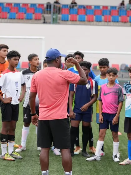 A coach addressing a group of aspiring players during our 3-day selection trials. We look for talent and a strong work ethic.