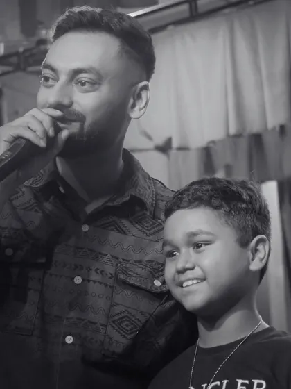 A heartwarming black and white photo with a young performer. Moments like these, encouraging young talent, are what make my job so rewarding.