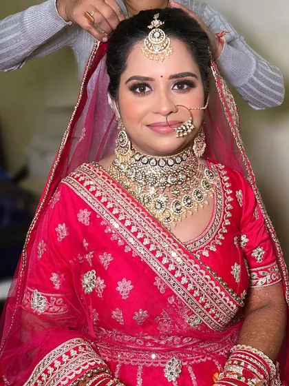 A behind the scenes shot of the final touches on Divya's hair and dupatta. I make sure every single detail is perfect before the bride steps out.