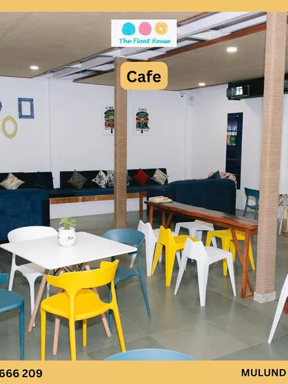 A look at our cozy and colorful cafe space. It's the perfect spot to relax, enjoy a meal, and watch the fun happening in the pool.
