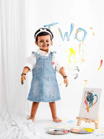 Let them be little and let them be messy! This fun paint-splatter theme for a second birthday shoot is all about capturing the pure, uninhibited joy of childhood creativity.