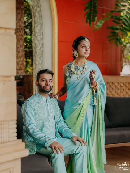 A serene portrait of the couple in their coordinated pastel blue Haldi outfits, a moment of calm amidst the joyful chaos.
