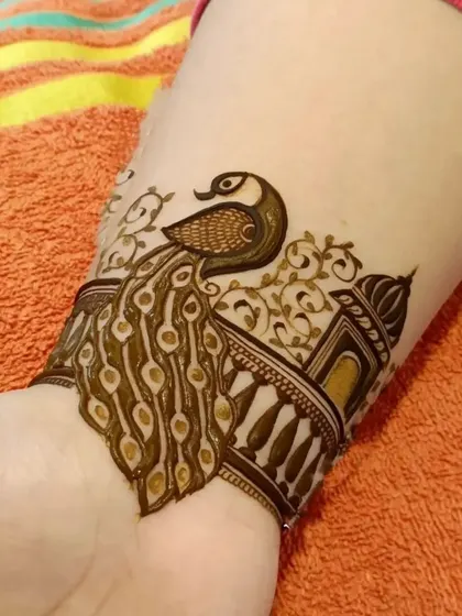 The final look of the peacock and jharokha wristband. The dark outlines and delicate inner patterns create a stunning contrast.