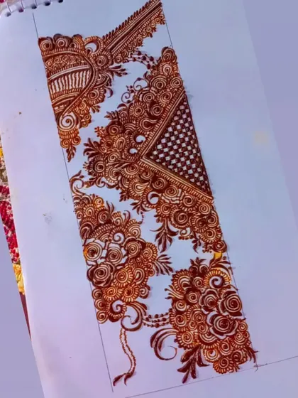 A practice sheet showing a complex bridal design with checks and floral elements.