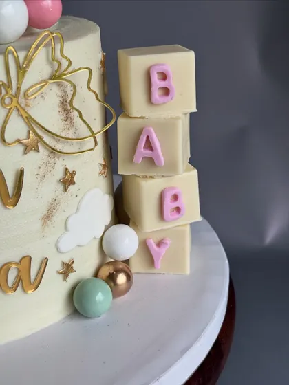 A detail shot from Neevah's naming ceremony cake, showing the edible 'BABY' blocks made from white chocolate.