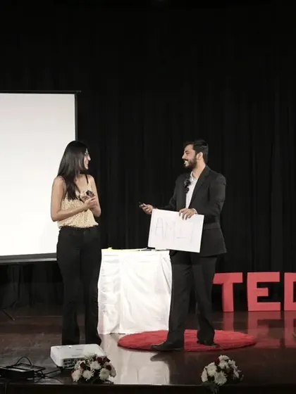 Performing a mind-reading demonstration with a volunteer during my TEDx talk.