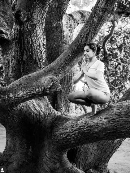 Finding my balance in Padangusthasana (Big Toe Pose) while perched on a tree. It’s a playful reminder that yoga can be practiced anywhere.