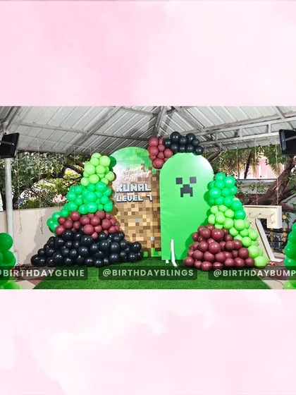 The Minecraft backdrop before all the characters were added, showing the foundational design with the Creeper panel and balloon arrangements.