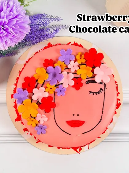 A delightful combination for a special day. This Strawberry Chocolate cake blends the sweetness of berries with rich chocolate, all decorated with our signature floral woman design for Women's Day.