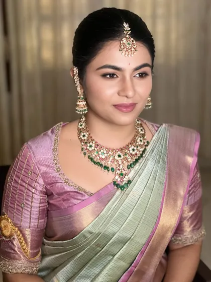 This portrait highlights the flawless base and soft contouring that enhances the bride's features. Achieving this natural-looking, sculpted look is a core skill I teach.