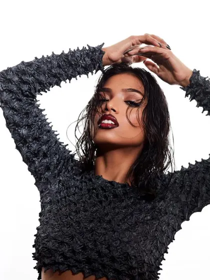 The wet hair look is a modern editorial staple. For this shot, I created a glossy, textured style paired with a bold, dark lip and sharp winged eyeliner to achieve a high-fashion, edgy aesthetic.