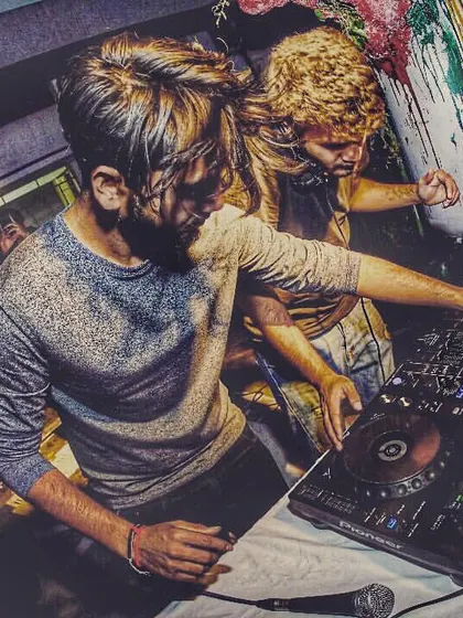 Deep in the mix at a club event. This up-close shot shows the technical side of our performance, tweaking the EQs and effects to build the perfect vibe.