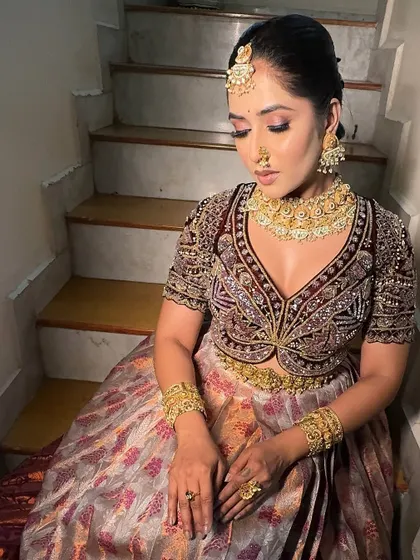 A seated portrait in the half-saree, showing how this style is both grand and comfortable for long events.