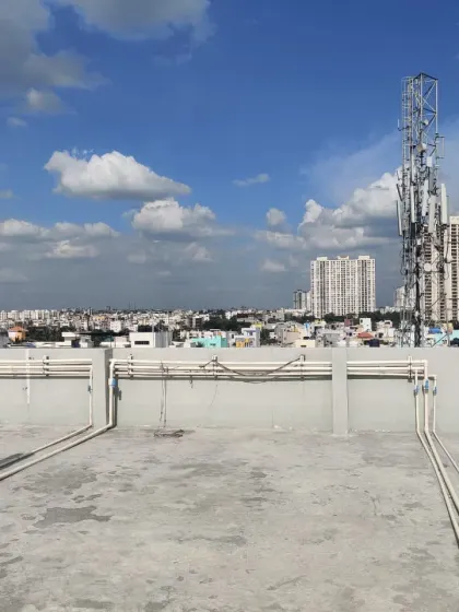 The same terrace from a different angle, showing the surrounding cityscape. My job is to create a green oasis right here in the middle of the urban environment.