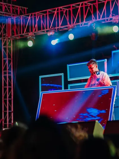 Here you can see the visuals in action on the multi-screen setup. I program these displays to sync with my set, creating a dynamic and cohesive audio-visual show.