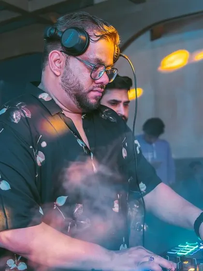 A shot of me at the decks, with the crowd and the club's ambiance creating a perfect backdrop.