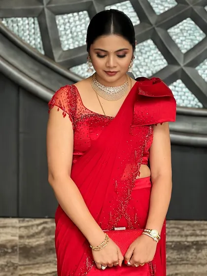A full-length shot of the client, her pose exuding confidence and glamour.
