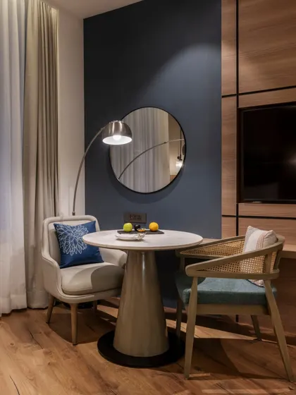 Additional views of the Radisson Resort, Khopoli, showcasing various interior and exterior details, from lobby seating areas and restaurant layouts to guest room configurations and architectural elements.