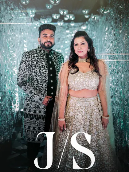 A stylish portrait of the couple in the silver tunnel, with their initials elegantly overlaid.