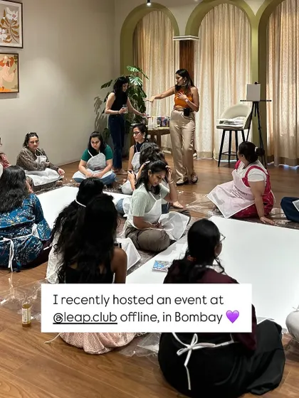 The beginning of our collaborative art session. It starts with a blank canvas on the floor and a room full of women ready to create something together.