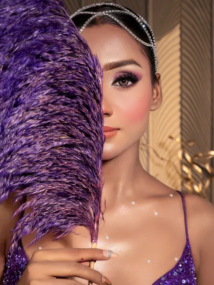 The "Mermaid" look, a stunning purple creation. This close-up shows the beautiful, iridescent makeup and the creative use of props.
