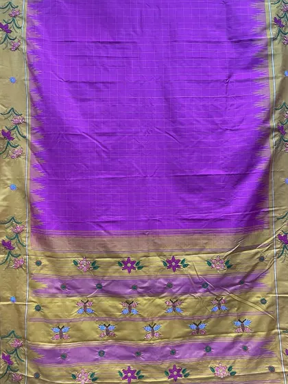 The full view of the custom-embroidered Kanjeevaram silk saree, showing how the Kamal Kadai motifs are placed along the border and pallu. Each element is thoughtfully positioned to create a cohesive and elegant design.