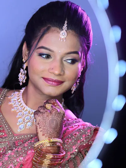 A creative bridal portrait using a ring light to frame the bride's face.