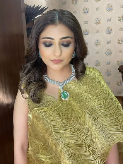 Eyes down, you can see the soft blend of brown and black tones. This creates a sophisticated smokey eye that is less intense than a full black one.