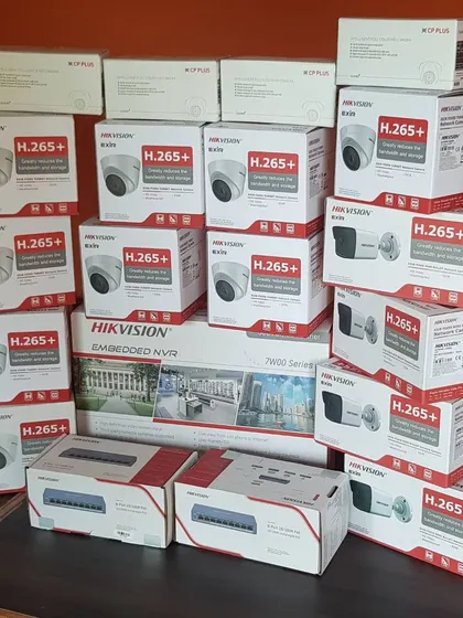 A complete IP camera system kit, including Hikvision dome and bullet cameras, an NVR, and PoE switches. Everything needed for a full setup.
