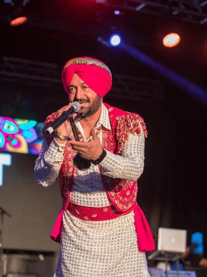 The King of Bhangra, Malkit Singh, commanding the stage. It was an honor to have him perform and share his legendary talent with our community in Queens.