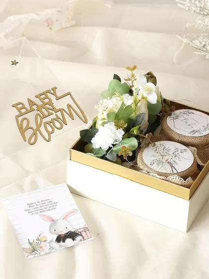 "Baby in Bloom" return favors for a baby shower. This elegant box contains a jar of buttery almond cookies and a jar of decadent brownie bites.