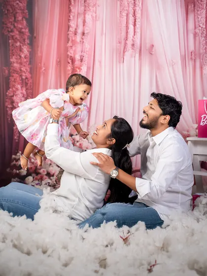 A moment of pure joy in a Barbie dreamland. This candid shot of a family playing together shows that even in our most creative themes, capturing family connection is always the priority.