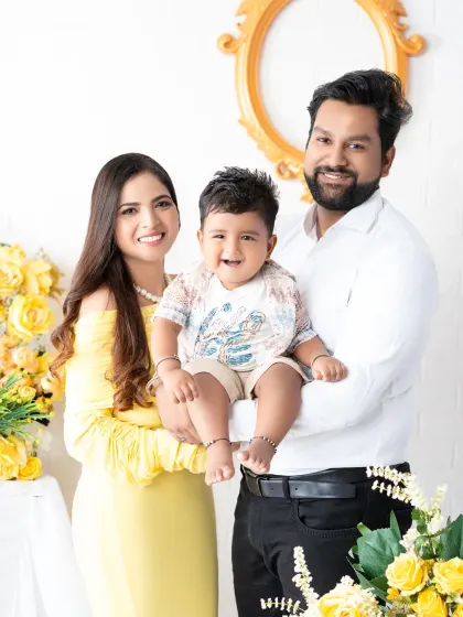 A bright and happy family portrait with a cheerful yellow color scheme. Coordinating outfits can create a beautifully cohesive look for your family photos.