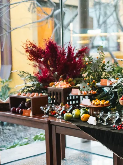A wide shot of our grand grazing table, showing the sheer abundance and variety of the spread. From fresh fruits to intricate desserts, it is designed to impress.