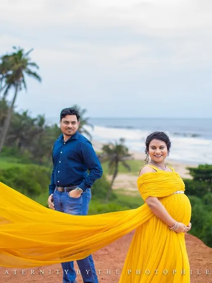The flowing yellow trail of the gown creates a beautiful leading line in this dynamic couple's portrait.