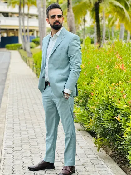 Another angle of the pastel suit against the lush greenery of Phuket. Style is all about the details.