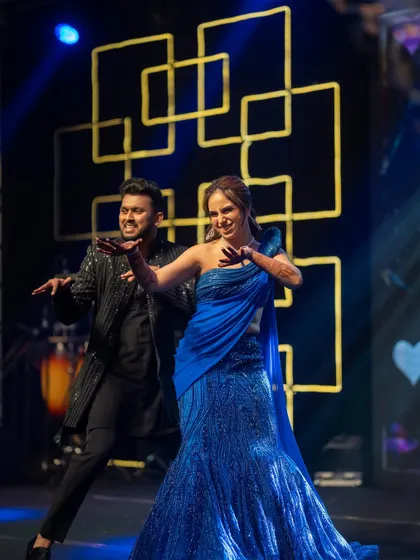 The couple showing off their moves on the Sangeet stage. Their chemistry was electric!