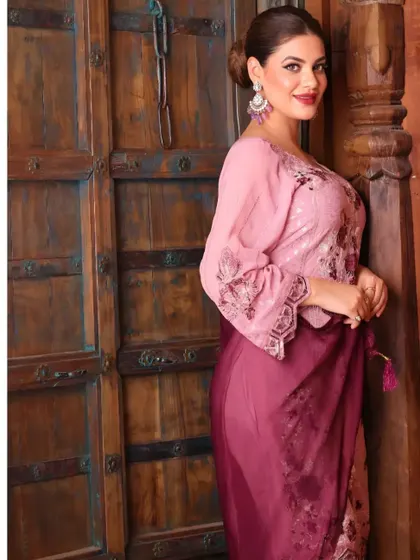 This pose from the same apparel shoot offers a different angle of the outfit, providing more visual information for the customer while maintaining the warm, rustic aesthetic.