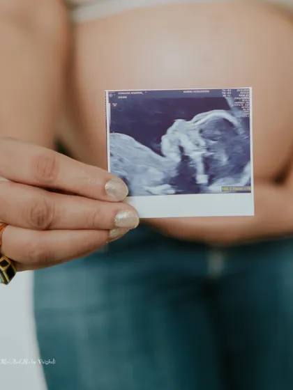 A close-up of the sonogram picture, with the baby bump as the perfect backdrop. This artistic shot is a simple yet profound way to celebrate your pregnancy.