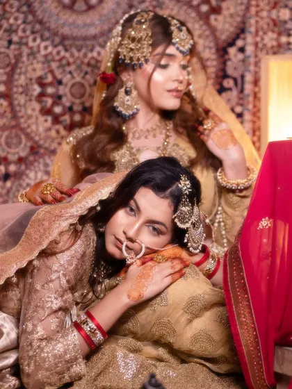Moments from our Heeramandi-inspired shoot. These images showcase the intricate details of the makeup, hair, and styling, capturing the mood and opulence of the era.