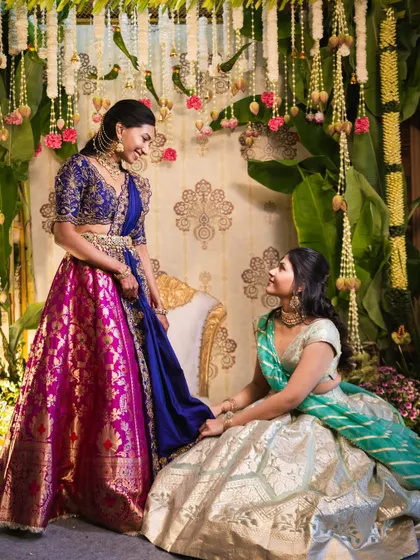 For our bride Sindhu, an architect with a clear vision, we designed this custom pellikuthuru backdrop. Drawing inspiration from a peacock's posture, we used traditional motifs and rich colors to create a gorgeous setting that complemented her outfit perfectly.