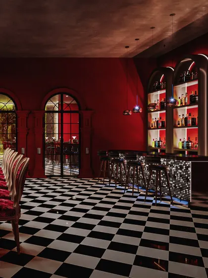 The main bar area, with its backlit shelves and sparkling mosaic-tiled front, is the focus of this vibrant render.