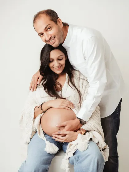 A happy and relaxed portrait. The couple's smiles radiate warmth and love, making for a perfect memory of this special time.