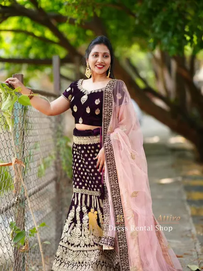 A smiling portrait in the dark velvet lehenga, perfect for capturing joyful pre-wedding memories.