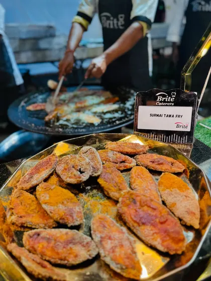 A close-up of golden, crispy Surmai Tawa Fry, a crowd-pleasing appetizer.