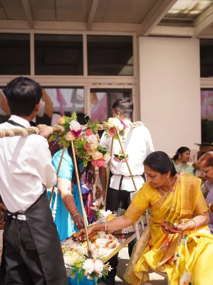 Our staff carrying a beautifully decorated mobile food platter through the crowd, allowing guests to easily pick and choose their favorites.