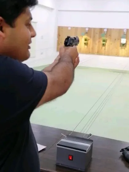 A client trying out a CO2 air pistol. While these are not ammunition-based firearms, I teach everyone to handle them with the same safety and respect.