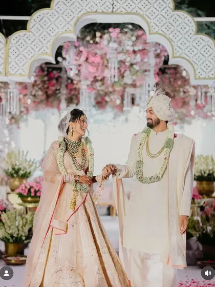 A beautiful wedding moment. The bride's hair is styled in a soft half updo, which works perfectly under her veil.